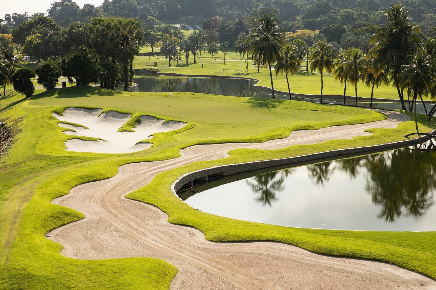 With an abundance of sand and water, the Serapong's 14th is one of the most demanding par-threes in the region.