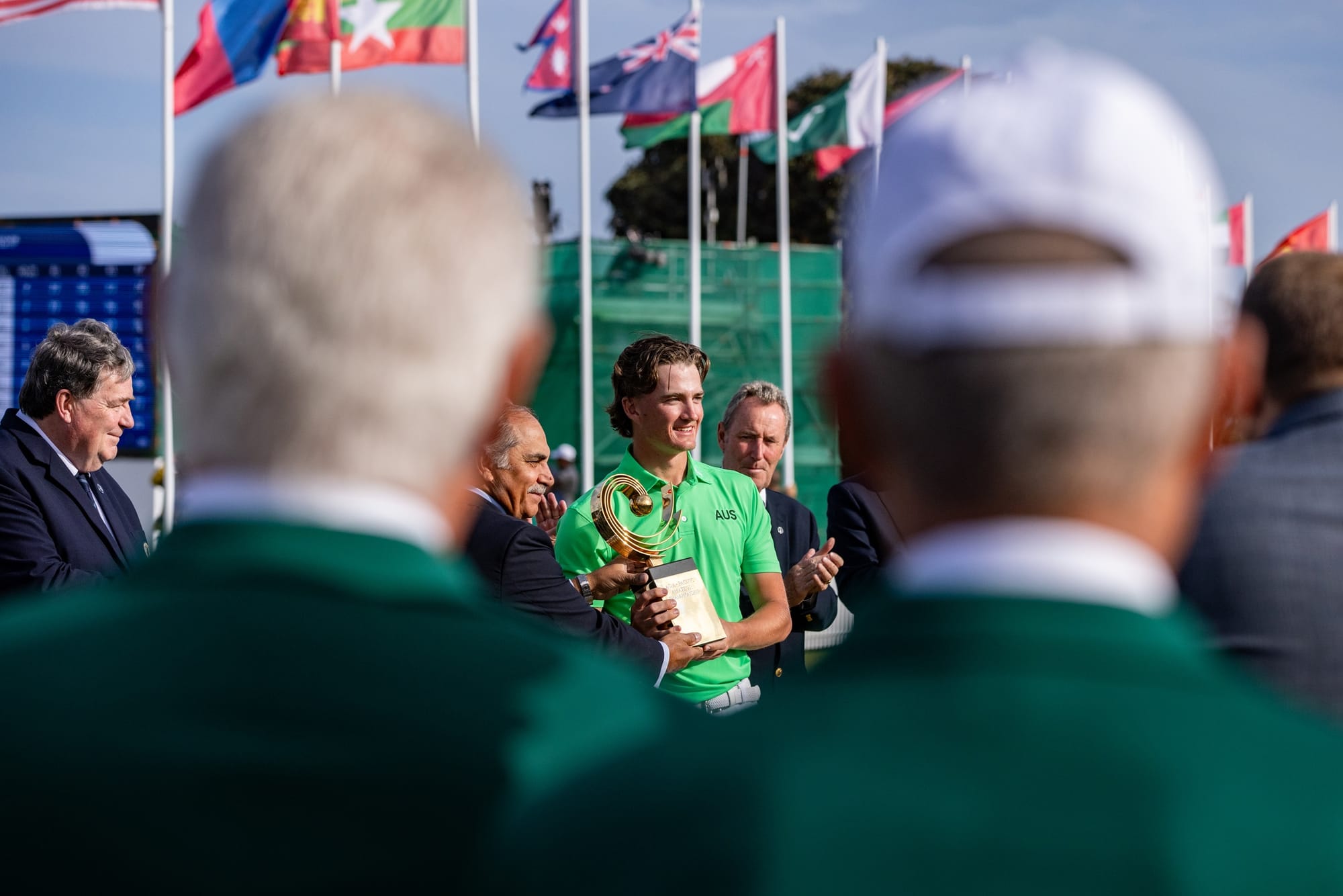 Jasper Stubbs receives the AAC trophy from Taimur Hassan Amin, Chairman of the APGC. Picture by AAC.