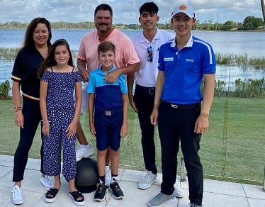 Jazz (far right) with caddie Camp Pulit and the Chopra family.
