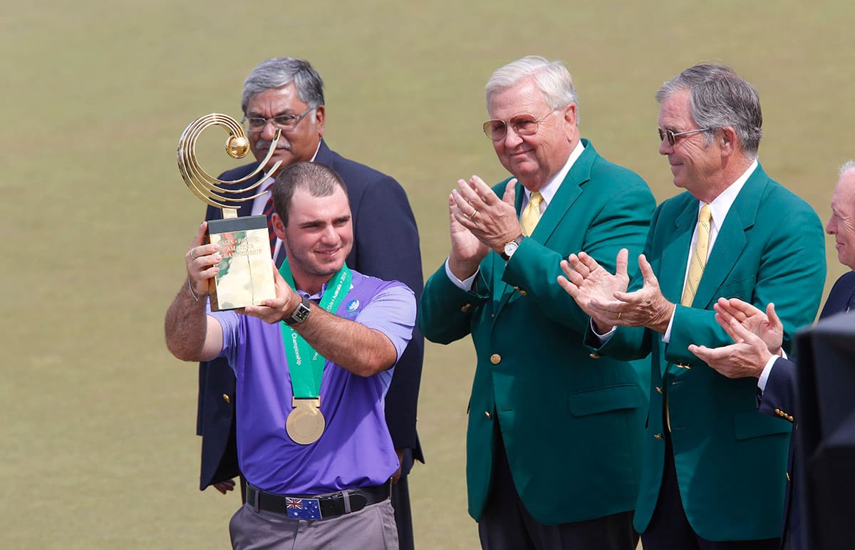 Antonio Murdaca holds aloft the Asia-Pacific Amateur Championship trophy..
