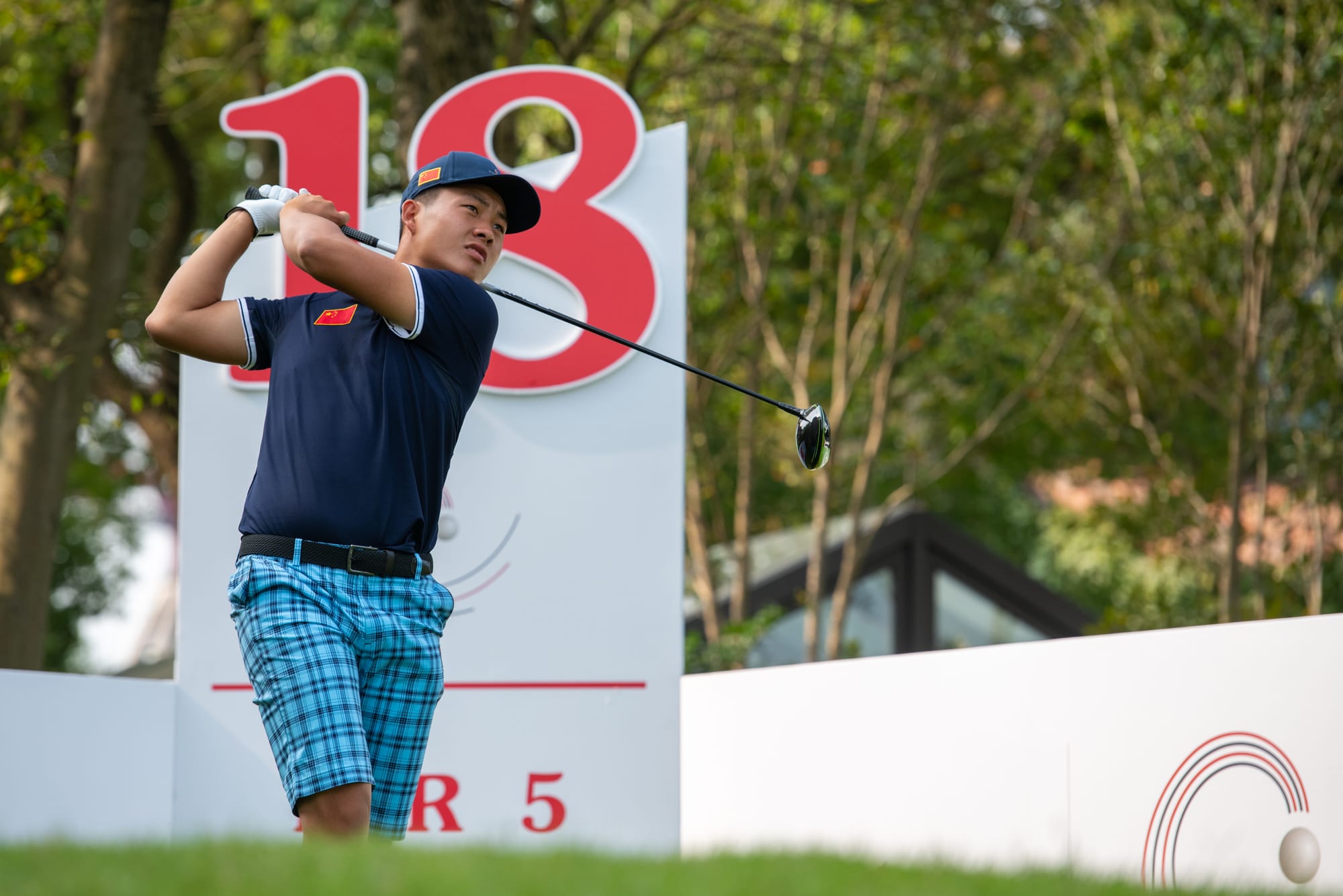 Lin Yuxin tees-off during the first-round.