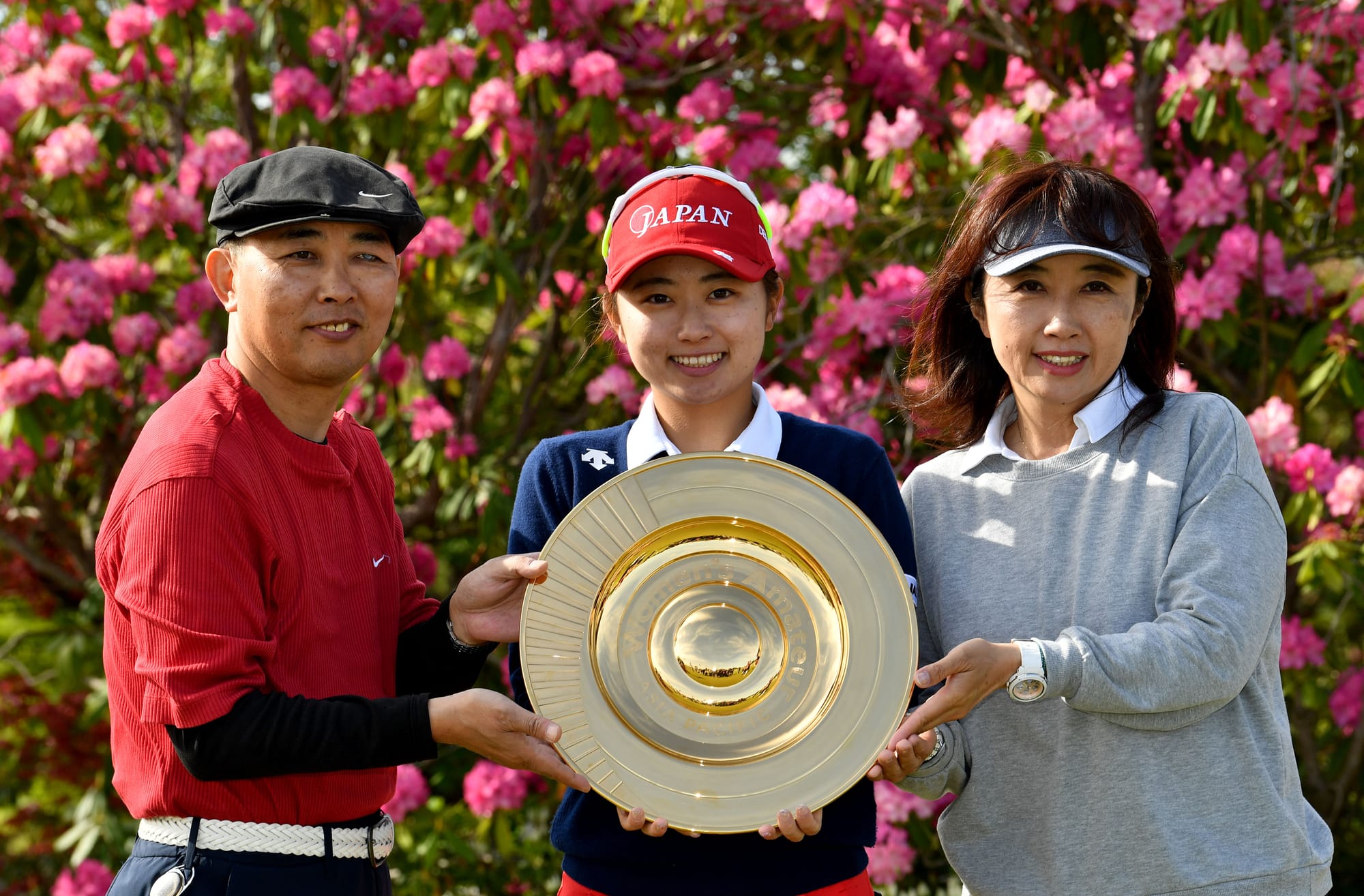 Yuka Yasuda shares her winning moment with her parents, Mitsuhiro and Mika.