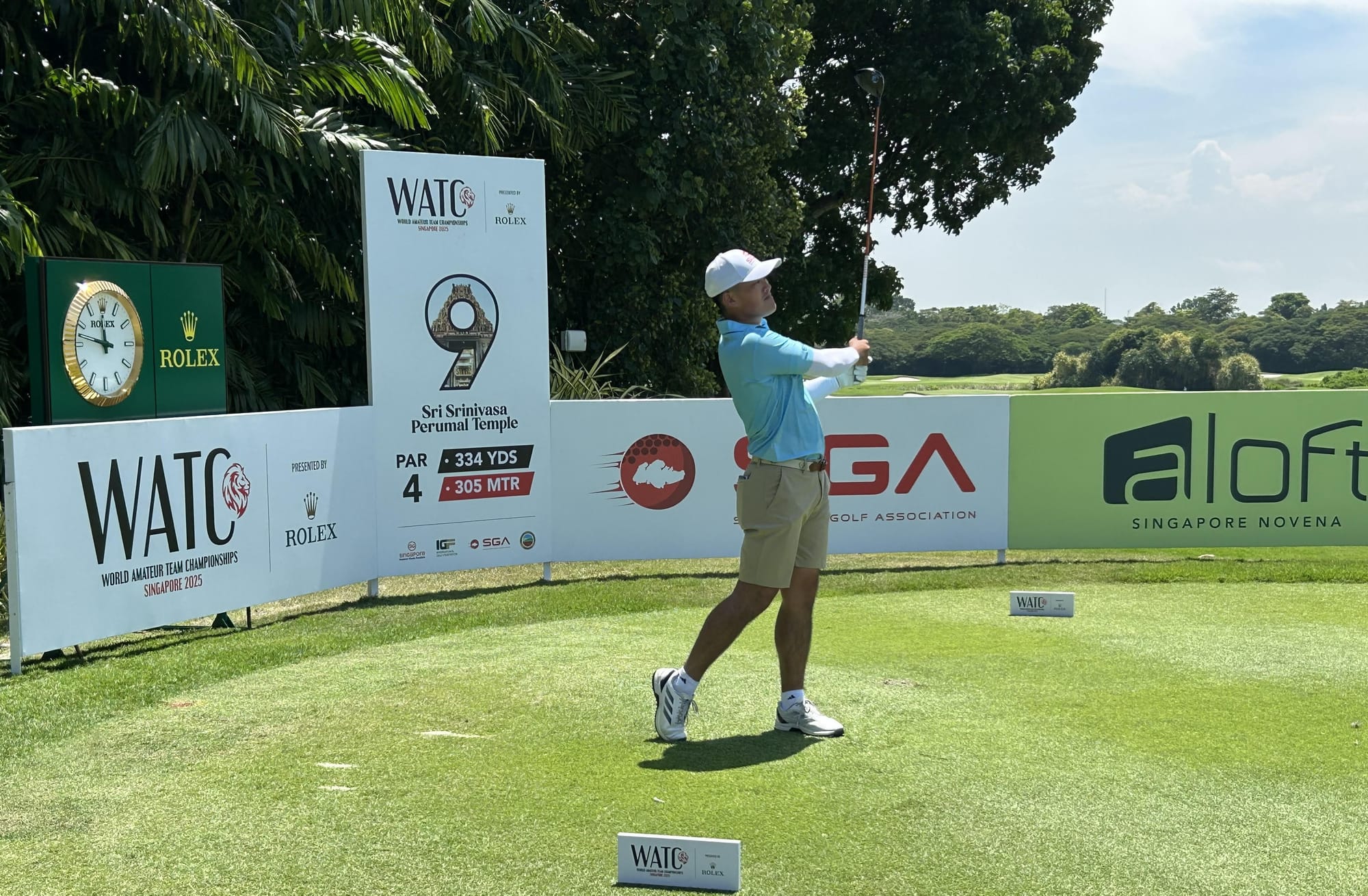 Hiroshi Tai follows the flight of his tee shot at the ninth hole, the Singaporean's final hole of the opening day at Tanah Merah Country Club.